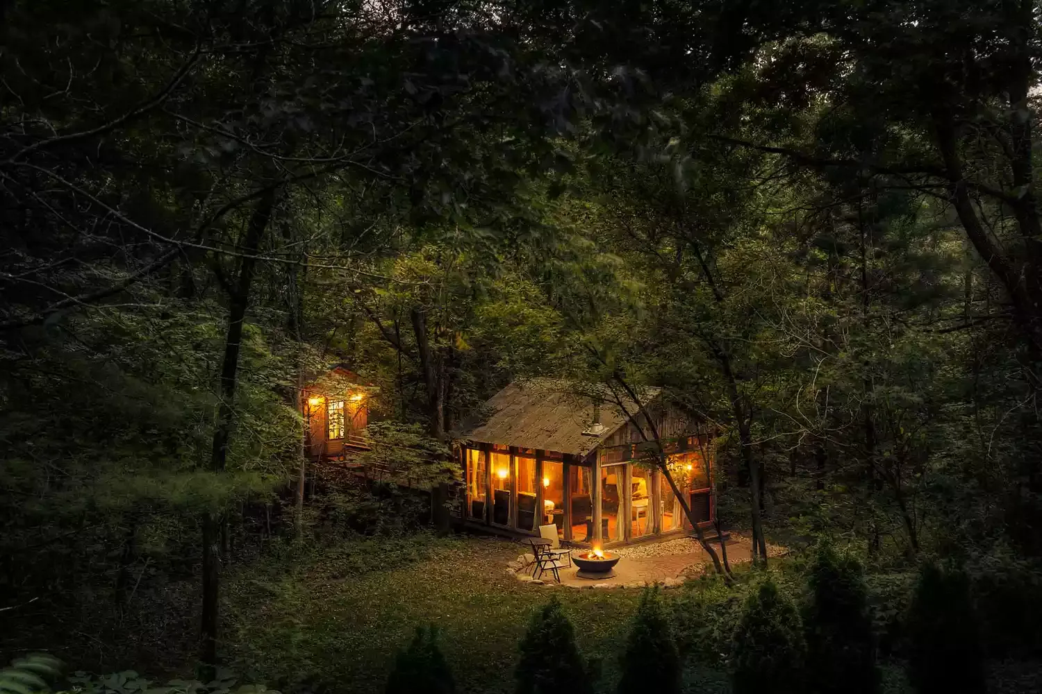 This Glass Cabin in the Wisconsin Woods Comes With Floor-to-ceiling Windows, a Cozy Fireplace, and Beautiful Forest Views