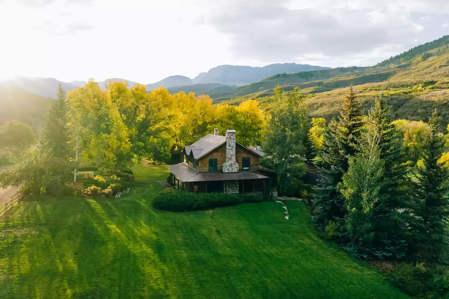 This All-inclusive Ranch in the Rocky Mountains Is in a National Forest — and It Has Luxurious Historic Log Cabins